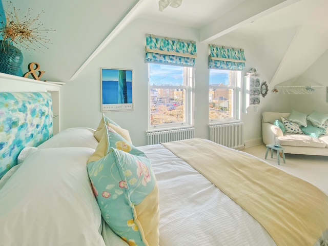 Floor to ceiling bespoke linen curtains in a sunlit modern interior